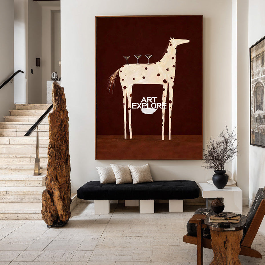 A large vertical wall art piece featuring a stylized beige giraffe on a dark brown background, displayed in a modern interior setting above a black bench.